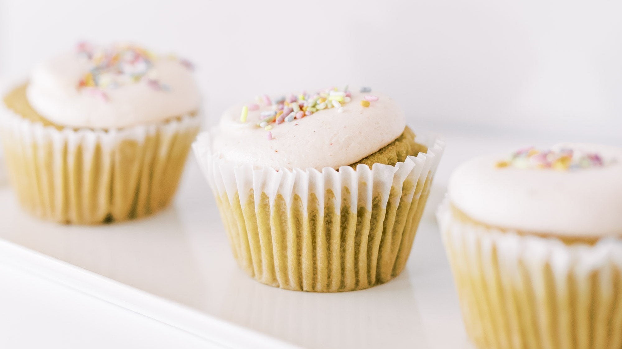 Vanilla Strawberry Cupcakes with Dye Free Sprinkles
